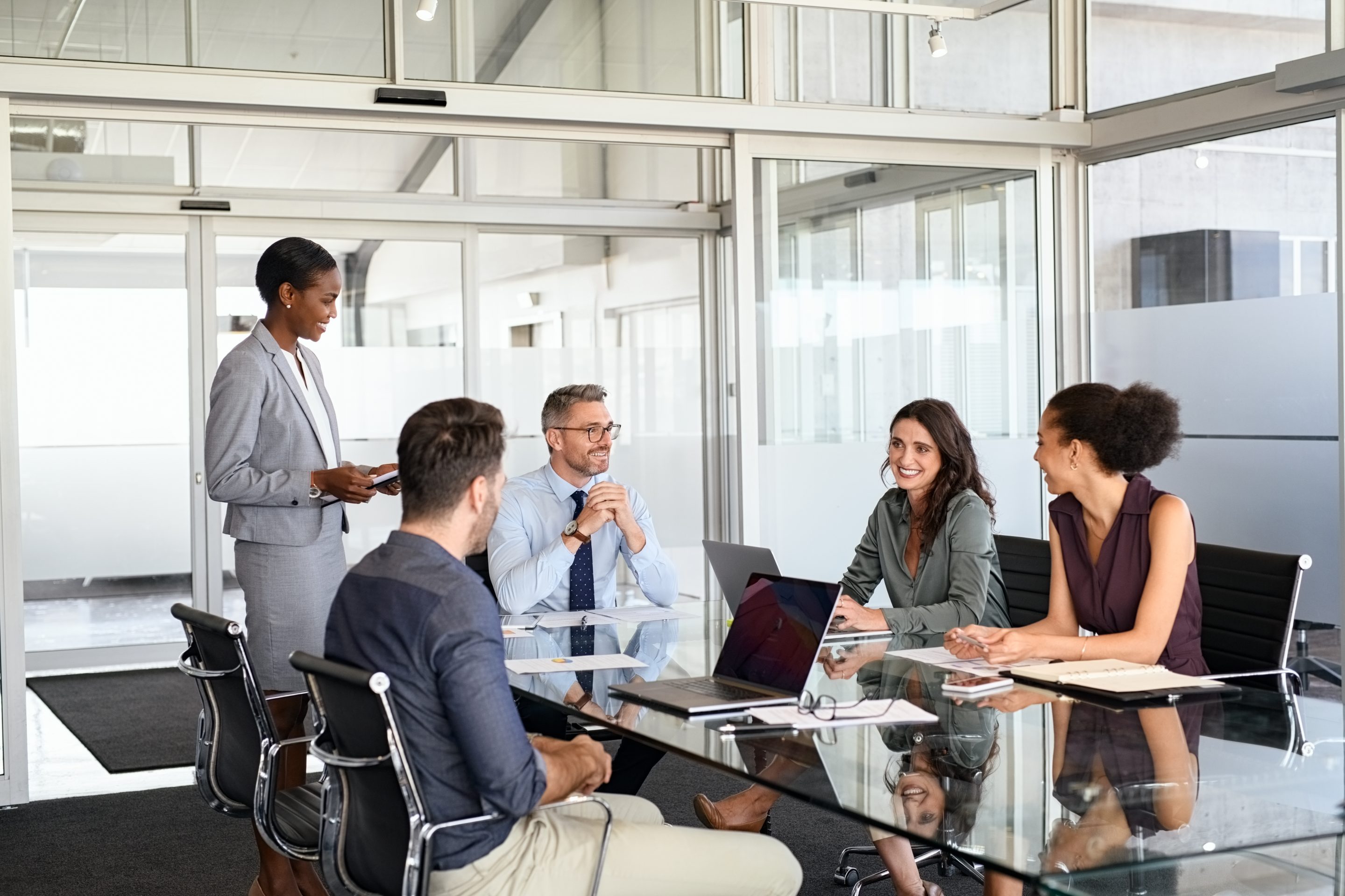 Formal business people in meeting room